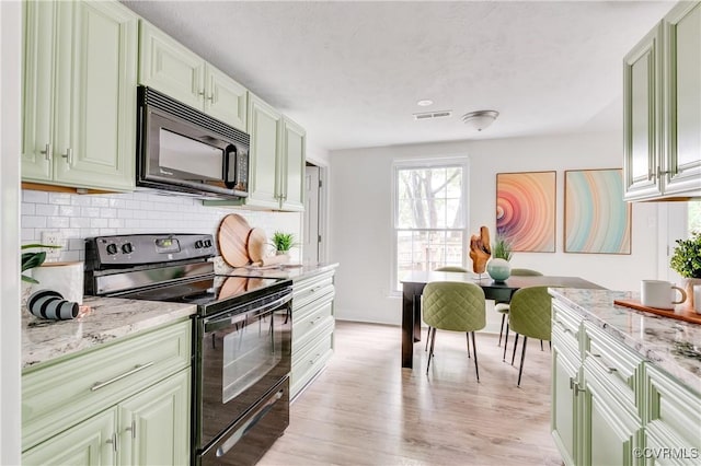 4814 Mill Park Ct, Glen Allen, VA 23060 - kitchen with black appliances, decorative backsplash, green cabinets, light stone counters, and light wood-style floors