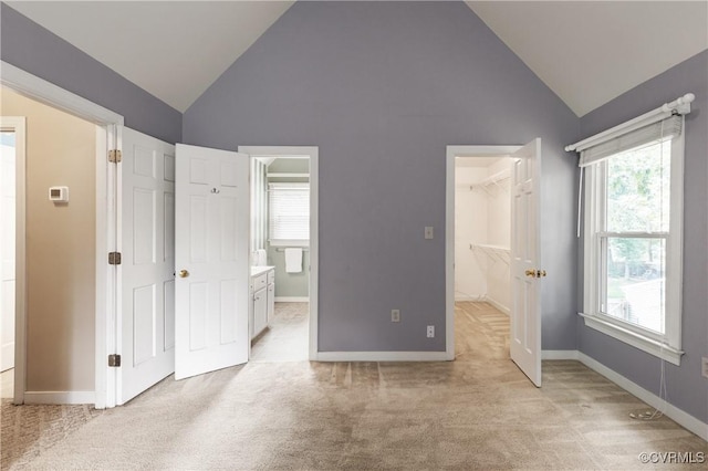 14106 Pensive Pl, Midlothian, VA 23112 - unfurnished bedroom with light colored carpet, a spacious closet, high vaulted ceiling, connected bathroom, and a closet