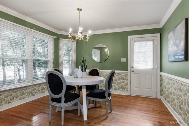 14106 Pensive Pl, Midlothian, VA 23112 - dining space featuring a wainscoted wall, a chandelier, wallpapered walls, wood finished floors, and ornamental molding