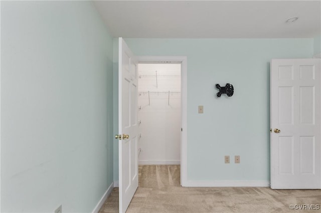 14106 Pensive Pl, Midlothian, VA 23112 - unfurnished bedroom featuring a walk in closet, light carpet, and a closet