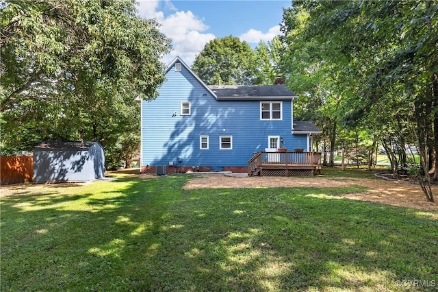 14106 Pensive Pl, Midlothian, VA 23112 - back of property with a storage unit, a chimney, a wooden deck, and a yard