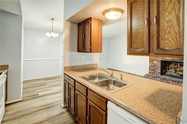 7131 Brook Way, Mechanicsville, VA 23111 - kitchen with light wood-style flooring, a fireplace, light countertops, a chandelier, and dishwasher