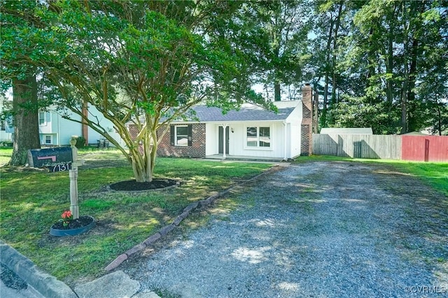 7131 Brook Way, Mechanicsville, VA 23111 - view of front of home featuring a chimney, driveway, and board and batten siding