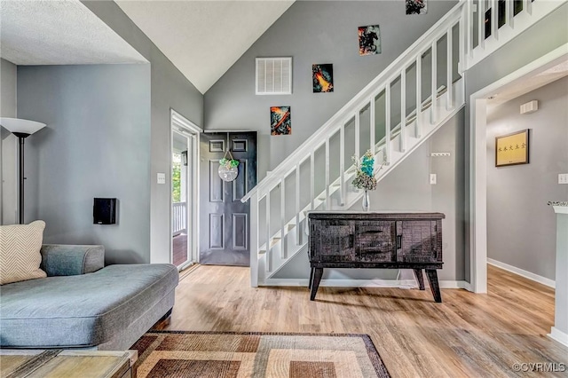 7100 Deer Thicket Dr, Midlothian, VA 23112 - foyer featuring wood finished floors, stairs, and high vaulted ceiling