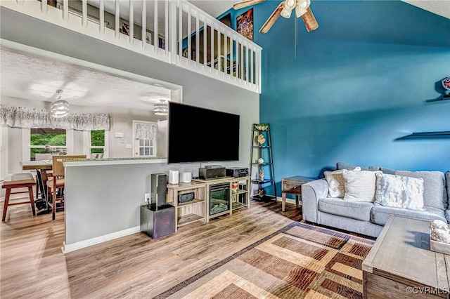 7100 Deer Thicket Dr, Midlothian, VA 23112 - living room with a ceiling fan, wood finished floors, a chandelier, and a towering ceiling