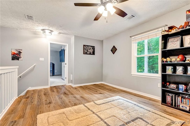 7100 Deer Thicket Dr, Midlothian, VA 23112 - unfurnished room with wood finished floors, a textured ceiling, and ceiling fan