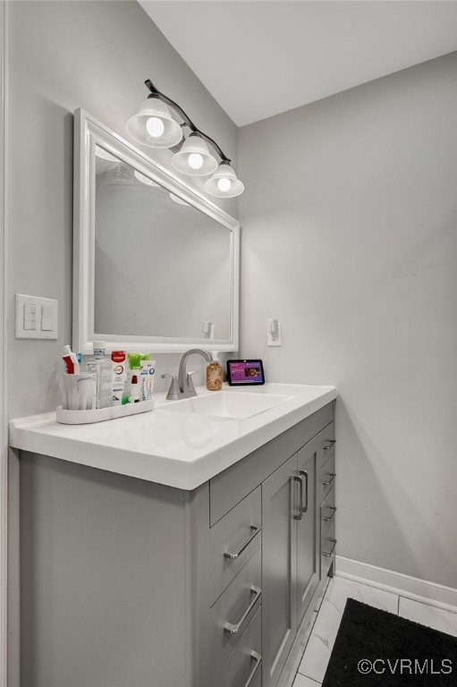 12900 Spring Run Rd, Midlothian, VA 23112 - bathroom featuring vanity and marble look tiles