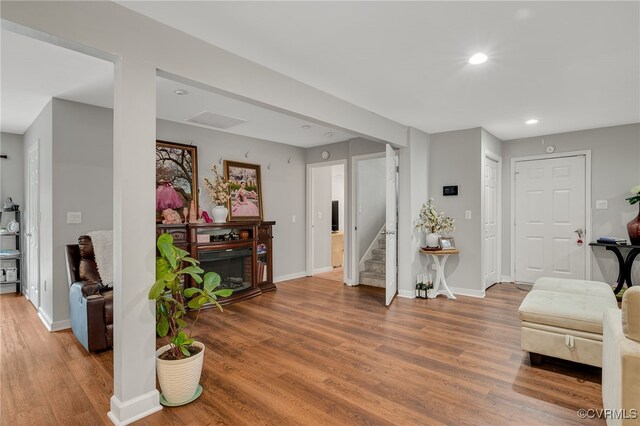 12900 Spring Run Rd, Midlothian, VA 23112 - entryway with wood finished floors, stairway, a fireplace, and recessed lighting