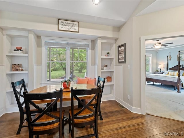 1130 Sparrows Ln, Powhatan, VA 23139 - dining room with dark wood-style flooring, built in shelves, and a ceiling fan