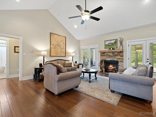 1130 Sparrows Ln, Powhatan, VA 23139 - living room with french doors, high vaulted ceiling, a ceiling fan, dark wood finished floors, and a stone fireplace