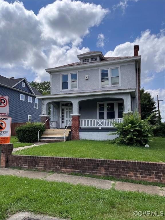 2214 2nd Ave, Richmond, VA 23222 - traditional style home featuring stucco siding, a porch, a front yard, and a chimney