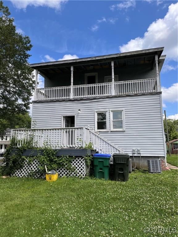 2214 2nd Ave, Richmond, VA 23222 - rear view of house featuring a balcony and a lawn