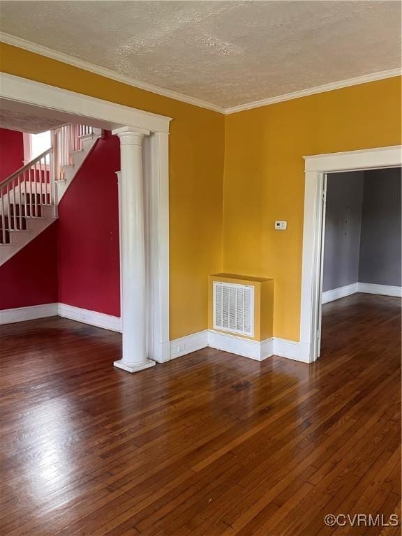 2214 2nd Ave, Richmond, VA 23222 - unfurnished living room with hardwood / wood-style flooring, stairs, ornamental molding, a textured ceiling, and decorative columns