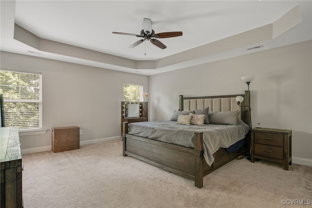 8307 Blackrail Pl, Chesterfield, VA 23832 - carpeted bedroom with a tray ceiling, multiple windows, and ceiling fan