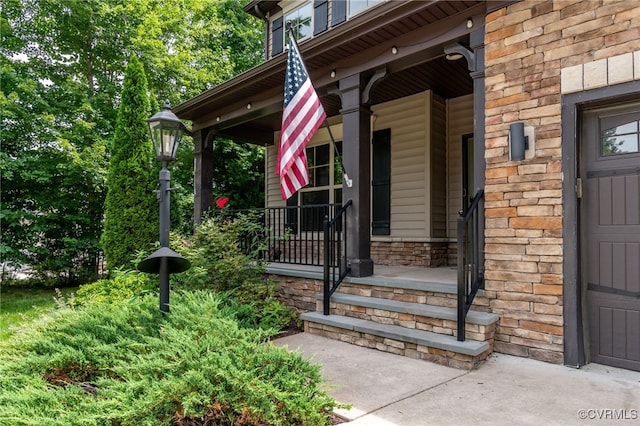 8307 Blackrail Pl, Chesterfield, VA 23832 - view of exterior entry featuring a porch, stone siding, and a garage