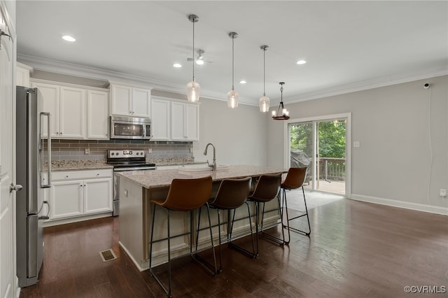 8307 Blackrail Pl, Chesterfield, VA 23832 - kitchen with stainless steel appliances, tasteful backsplash, crown molding, dark wood-style flooring, and light stone countertops