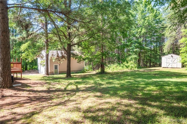 14560 Meade Rd, Amelia, VA 23002 - view of green lawn featuring a storage shed and a deck