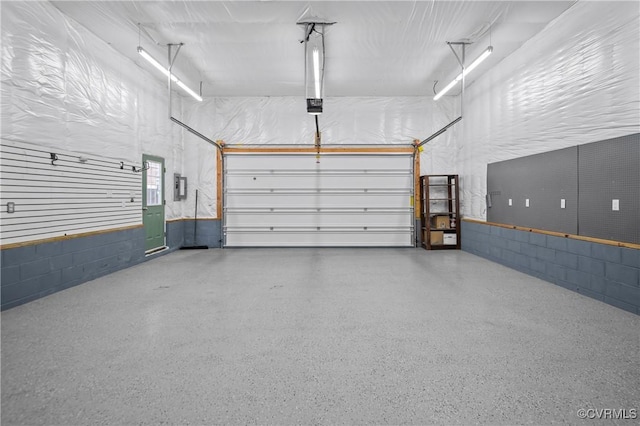 14560 Meade Rd, Amelia, VA 23002 - garage with a garage door opener, concrete block wall, and electric panel