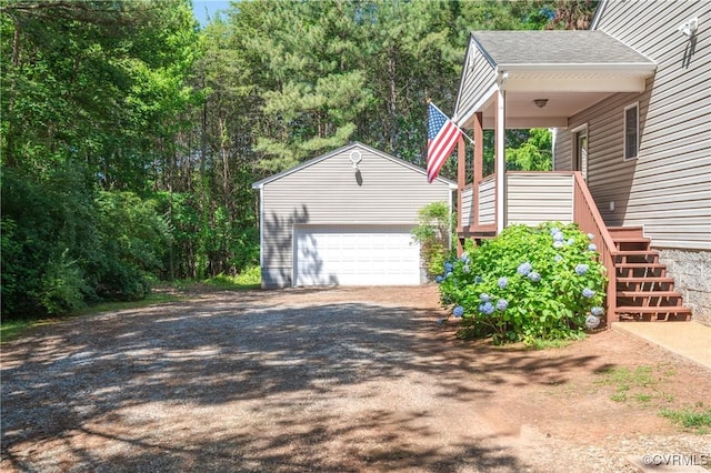 14560 Meade Rd, Amelia, VA 23002 - view of side of home featuring an outdoor structure, stairs, a detached garage, a shingled roof, and driveway
