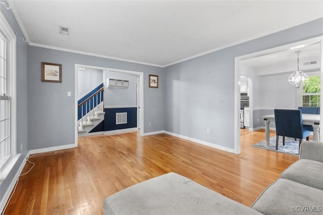 4709 Tameo Ct, Glen Allen, VA 23060 - living area with stairway, wood finished floors, a chandelier, and ornamental molding