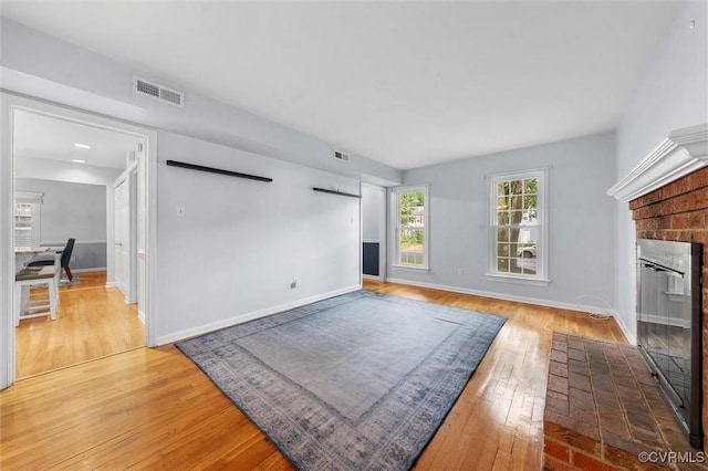 4709 Tameo Ct, Glen Allen, VA 23060 - unfurnished living room featuring light wood-style flooring and a fireplace