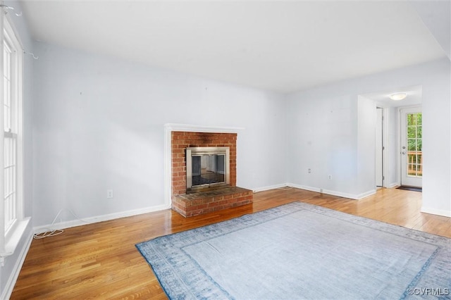 4709 Tameo Ct, Glen Allen, VA 23060 - unfurnished living room featuring wood finished floors and a brick fireplace