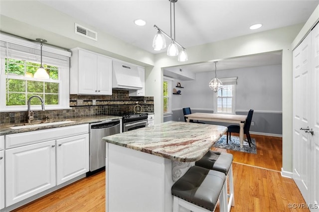 4709 Tameo Ct, Glen Allen, VA 23060 - kitchen featuring custom exhaust hood, stainless steel appliances, dark stone countertops, white cabinets, and recessed lighting
