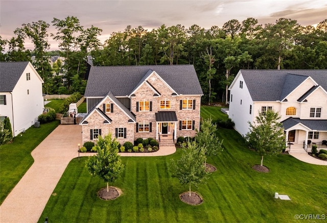 11075 Ellis Meadows Ln, Glen Allen, VA 23059 - view of front of home with stone siding, driveway, and a front yard