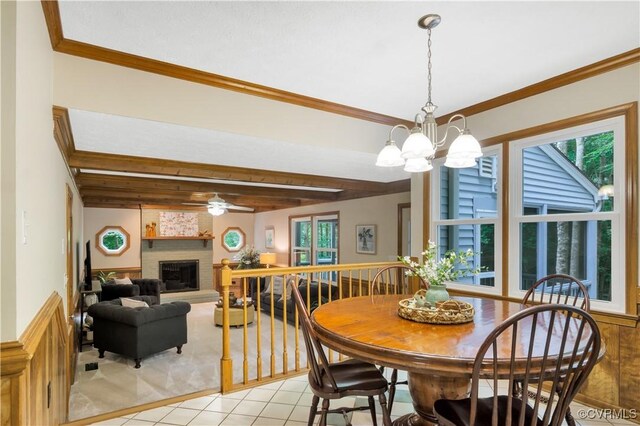 2801 Starling Dr, Williamsburg, VA 23185 - dining space featuring healthy amount of natural light, beam ceiling, a fireplace, a chandelier, and ceiling fan