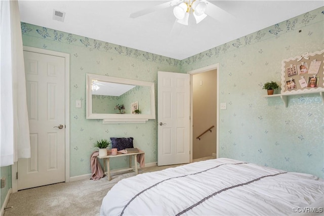 2801 Starling Dr, Williamsburg, VA 23185 - carpeted bedroom with wallpapered walls and a ceiling fan