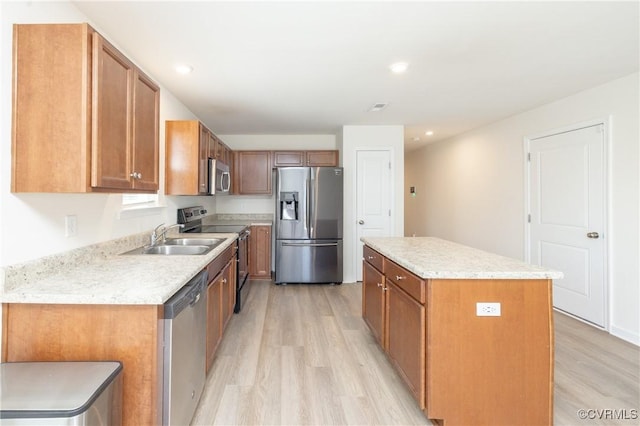 1712 Binford Ct, Cobbs Creek, VA 23223 - kitchen featuring stainless steel appliances, light wood-style flooring, a kitchen island, light countertops, and recessed lighting