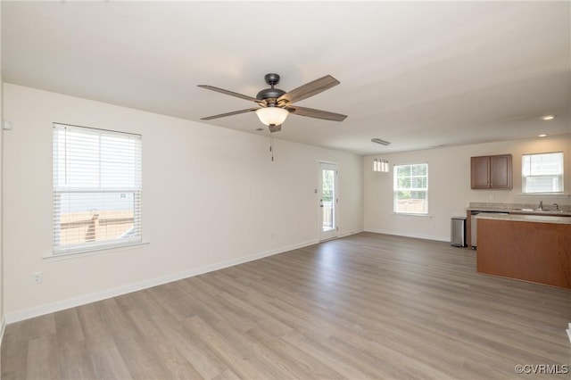 1712 Binford Ct, Cobbs Creek, VA 23223 - unfurnished living room with ceiling fan and light wood-style floors