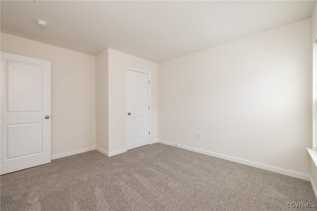 1712 Binford Ct, Cobbs Creek, VA 23223 - carpeted spare room with baseboards and a smoke detector