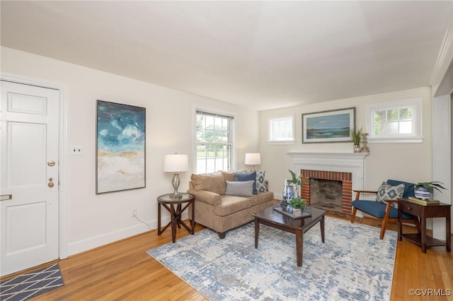 4024 W Grace St, Richmond, VA 23230 - living room featuring healthy amount of natural light, light wood-style flooring, and a fireplace