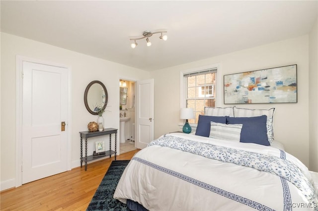 4024 W Grace St, Richmond, VA 23230 - bedroom with light wood-style flooring and baseboards