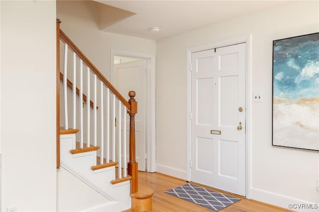 4024 W Grace St, Richmond, VA 23230 - entryway featuring light wood-type flooring and stairway