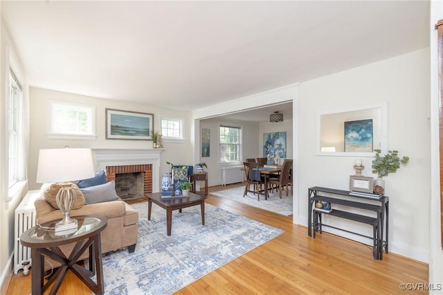 4024 W Grace St, Richmond, VA 23230 - living room featuring a fireplace and light wood-style floors
