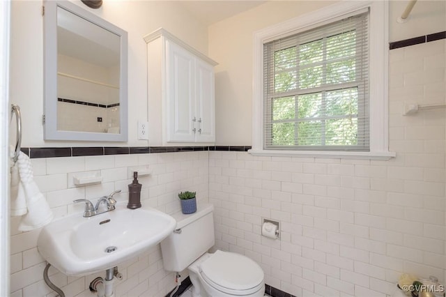 4024 W Grace St, Richmond, VA 23230 - bathroom with a sink and tile walls