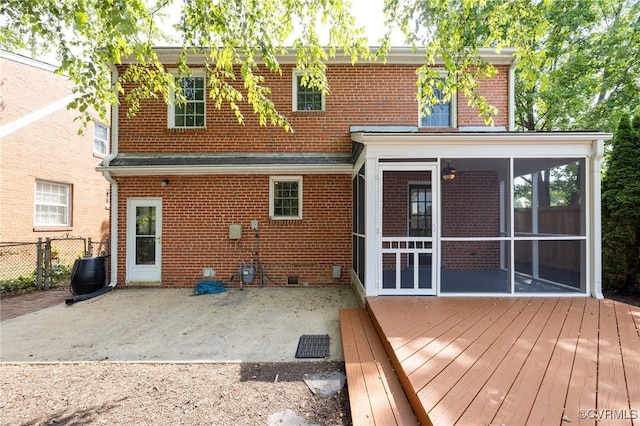 4024 W Grace St, Richmond, VA 23230 - rear view of house featuring a sunroom, brick siding, and a patio