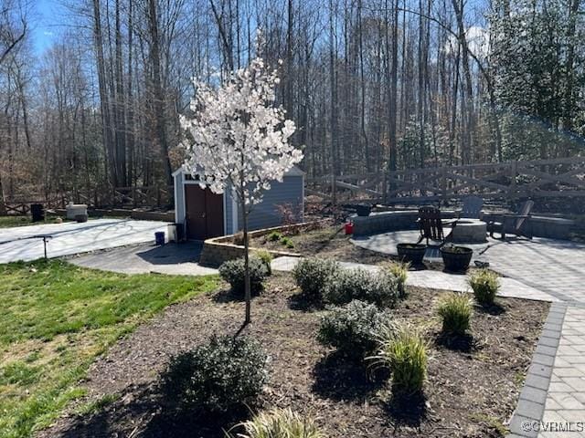 9377 Magnolia Blossom Rd, Ashland, VA 23005 - view of yard featuring a storage unit and a patio area