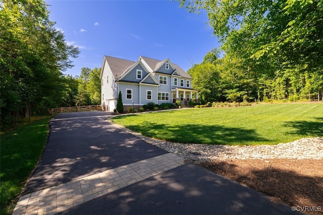 9377 Magnolia Blossom Rd, Ashland, VA 23005 - view of front of home with asphalt driveway, a front lawn, and an attached garage