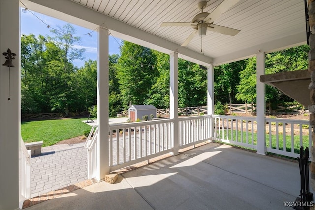 9377 Magnolia Blossom Rd, Ashland, VA 23005 - view of patio featuring a storage unit, ceiling fan, and view of scattered trees