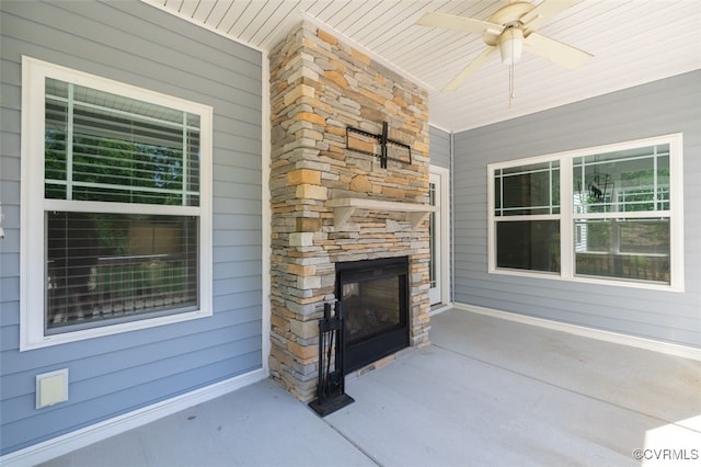9377 Magnolia Blossom Rd, Ashland, VA 23005 - view of patio / terrace with an outdoor stone fireplace and a ceiling fan