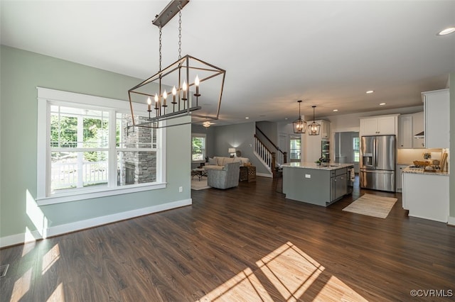 9377 Magnolia Blossom Rd, Ashland, VA 23005 - kitchen featuring stainless steel refrigerator with ice dispenser, open floor plan, a kitchen island, white cabinets, and pendant lighting
