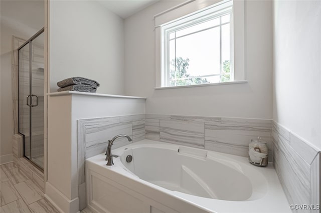 9377 Magnolia Blossom Rd, Ashland, VA 23005 - full bathroom featuring a garden tub, a shower stall, and marble look tiles
