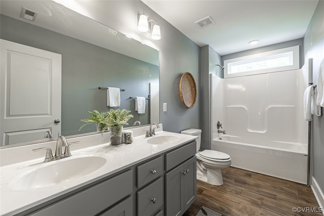 9377 Magnolia Blossom Rd, Ashland, VA 23005 - full bathroom featuring double vanity, wood finished floors, and shower / tub combination