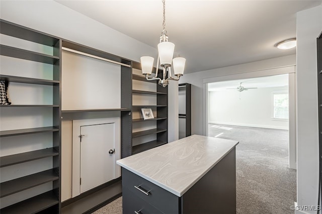 9377 Magnolia Blossom Rd, Ashland, VA 23005 - walk in closet featuring carpet flooring, a chandelier, and a ceiling fan