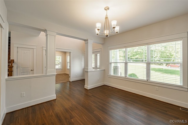 9377 Magnolia Blossom Rd, Ashland, VA 23005 - spare room with ornate columns, dark wood-style floors, and a chandelier