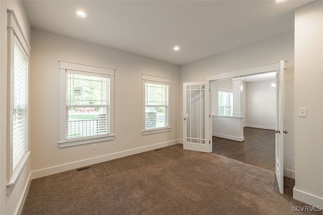 9377 Magnolia Blossom Rd, Ashland, VA 23005 - spare room with dark carpet, recessed lighting, and french doors