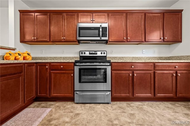 9949 Reymet Ct, North Chesterfield, VA 23237 - kitchen featuring appliances with stainless steel finishes and light stone countertops
